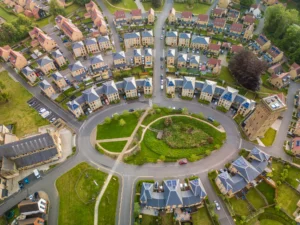 Aerial drone view of the Cane Hill area in Coulsdon, UK, with new houses and parklands.